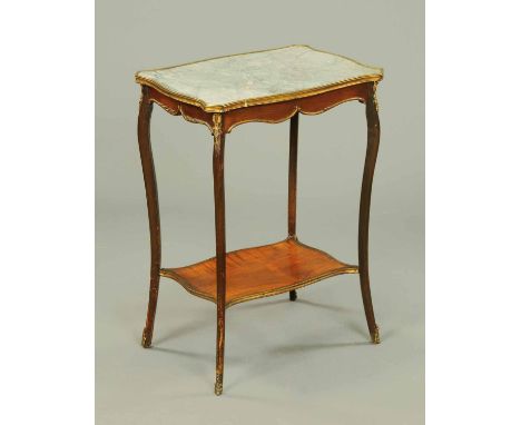 An Edwardian side table, in the French style, with variegated grey marble top, four cabriole legs with metal mounts and sabot