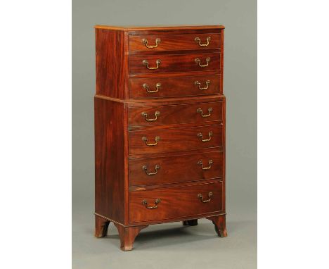 An Edwardian mahogany bowfronted tall chest of drawers, seven drawers with brass drop handles and cockbeading and raised on s