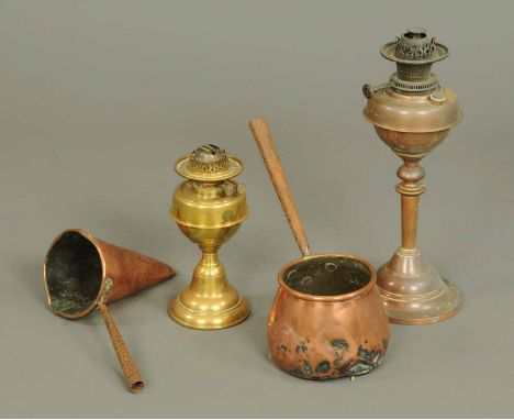 A Victorian copper oil lamp, a brass oil lamp and two measures.   