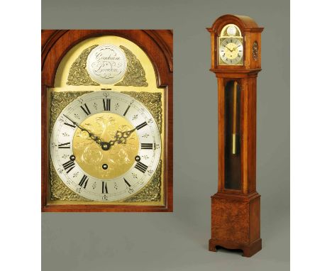 A walnut cased grandmother clock, by Canham of London, with three-train striking movement and in well figured case raised on 
