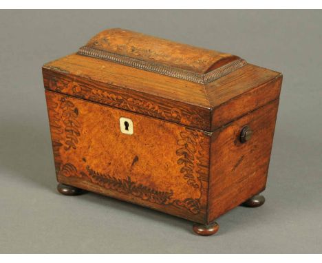 A Regency rosewood and burr walnut tea caddy, sarcophagus form, raised on four bun feet.  Width 8 ins.   CONDITION REPORT: Th