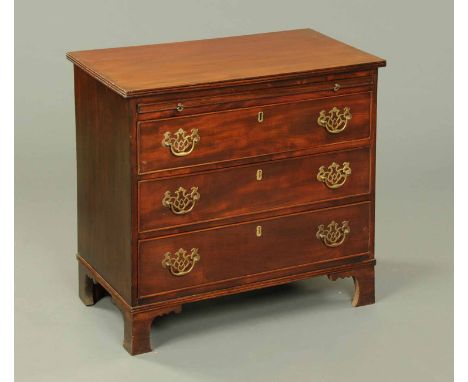 A George III style mahogany chest of drawers, with slide and raised on bracket feet.  Width 29 ins. 