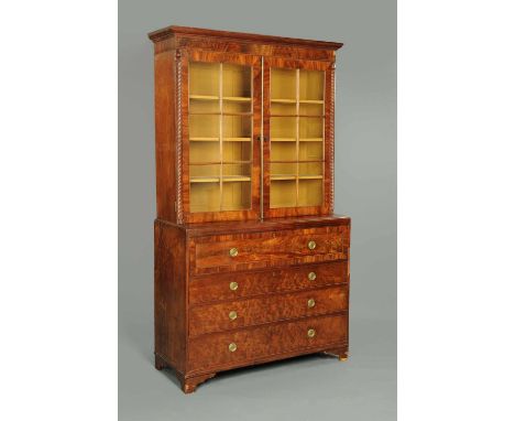 A Regency mahogany secretaire bookcase, in two sections, with moulded cornice above a pair of glazed doors with wooden astrag