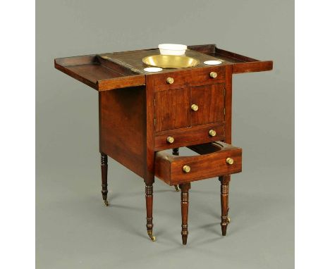 A George III mahogany fitted commode/washstand, with hinged top and raised on short turned legs. Width 17.5 ins. 