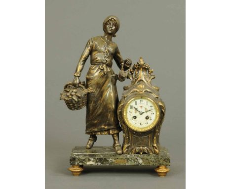 A 19th century French figural mantle clock, "Retour du Marche".  Height 20 ins. 