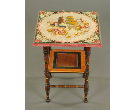 A late Victorian occasional table, with beadwork top and raised on four turned legs united by a raised shelf.  Width 19 ins. 