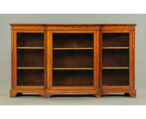 An Edwardian mahogany breakfront low bookcase, with satinwood crossbanded, boxwood and ebony strung top, with moulded edge an