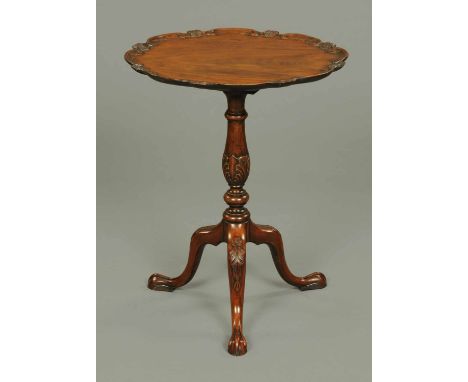 A 19th century Chippendale style snap top occasional table, with moulded piecrust edge, turned and foliate column and raised 