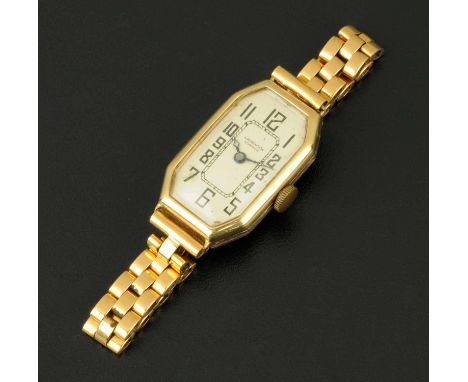A 9 ct gold cased ladies wristwatch by J.W. Benson of London, with octagonal silvered dial with Arabic numerals, the strap st