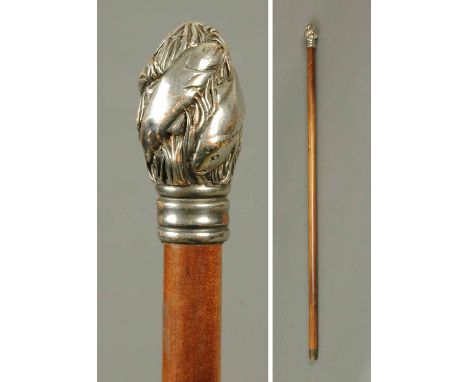 A 19th century walking stick, the finial being silver plated on copper and depicting fish and seaweed.  Height 36 ins. 