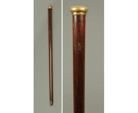 A heavy 19th century Chinese hardwood measuring stick, with character marks to shaft and with engine turned terminal.  Height