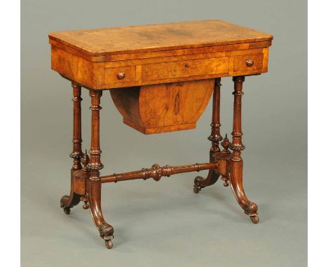 A Victorian burr walnut combined games and worktable, with turnover top with baize lined playing surface and fitted with thre