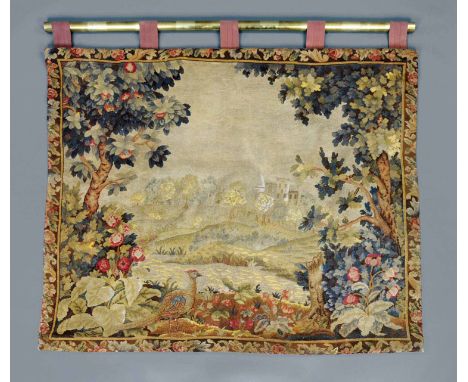 A 19th century woolwork tapestry wall hanging, depicting a pheasant in rolling rural landscape with fruit and oak trees, with