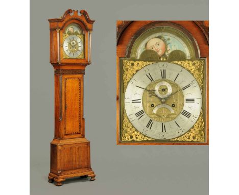 A George III oak and mahogany crossbanded longcase clock by John Stancliffe, with swans neck pediment above the arched brass 