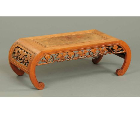 A late 19th/early 20th century Chinese low table, with pierced gallery and sabre type scroll legs.  Length 37.5 ins (see illu