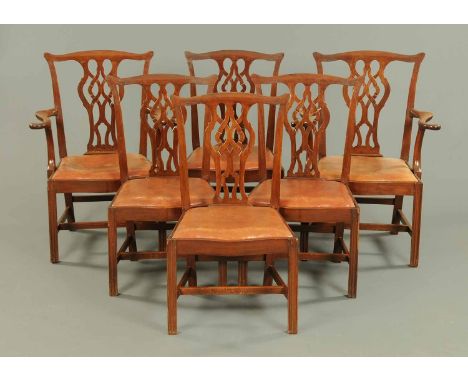 A set of six Edwardian mahogany Chippendale style dining chairs, comprising two arm and four single chairs, each with pierced