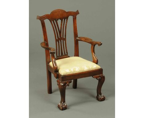 An Edwardian mahogany child's chair, in the Chippendale style (see illustration). 