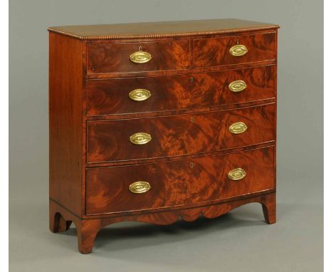 A 19th century mahogany bowfronted chest of drawers, with two short and three long graduated drawers with brass drop handles 