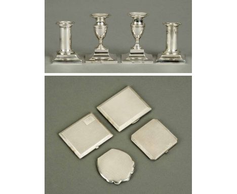 A pair of silver coloured metal candlesticks, height 4.25 ins, and a pair of silver plated candlesticks, height 3.75 ins, two