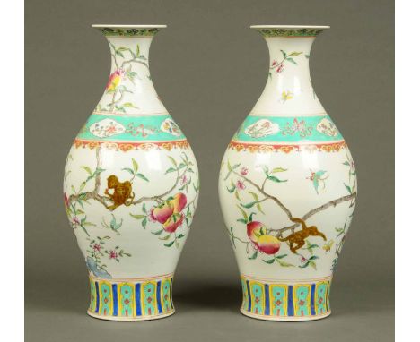 A pair of Chinese vases, decorated with peach blossom and each with six character mark to base.  Height 17 ins.  CONDITION RE