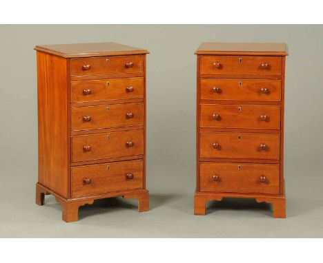 A pair of Victorian mahogany pedestal chests, each with moulded edge, five long graduated drawers with wooden knob handles an