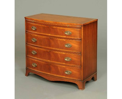 A Bevan Funnel mahogany bowfronted chest of drawers, with slide above four long graduated drawers with brass drop handles wit