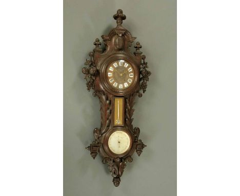 A large combined aneroid barometer clock and thermometer, with foliate and scroll carved oak case, the clock with two-train m