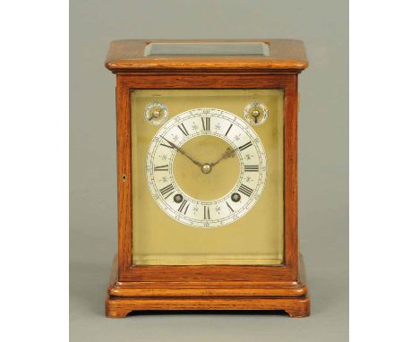 An oak cased mantle clock, with Winterhalder & Hofmeier movement, with silvered brass dial with subsidiary dials and two-trai