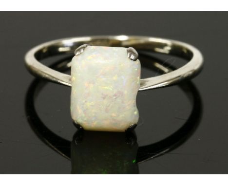 A white gold single stone opal ring, marked 18ct