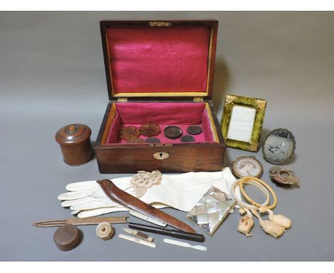 A Victorian rosewood box, containing assorted curios, coins, mother-of-pearl card case, treen, etc.