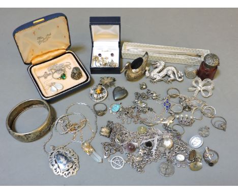 A silver gilt quartz crystal pendant, claw set with a diamond, a sterling silver ball pen, a sterling silver hinged bangle, a