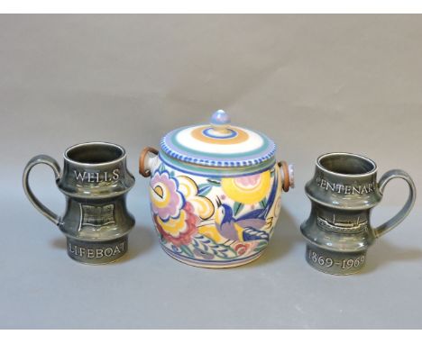 A Poole pottery ice bucket, bird amongst foliage, together with two Holkham Pottery tankards