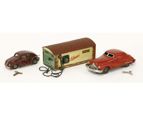 A Dux tinplate clockwork Beetle, with key, a Schuco Gama 100 clockwork car, with key, and a Schuco Garage Imagico 500, unboxe