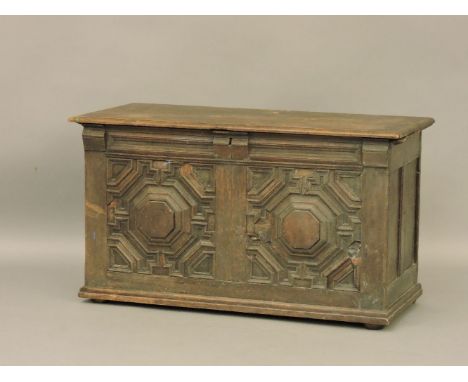 An antique oak geometric two panel coffer, 115cm wide