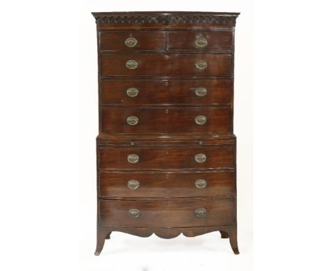 A George III mahogany bow front chest-on-chest,with an arcaded frieze over two short and three long drawers, on a base with a