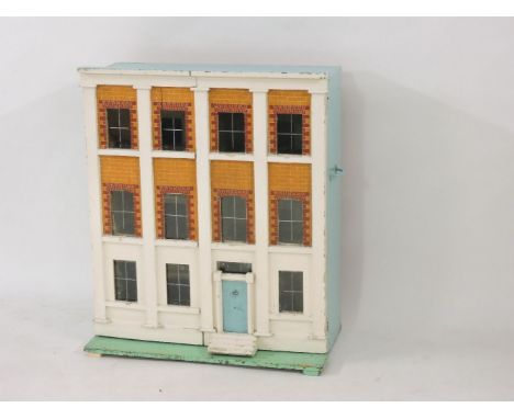 A Victorian three-storey doll's house, 76cm wide, 93cm high, 42cm deep overall, each room with a fire grate, the kitchen with