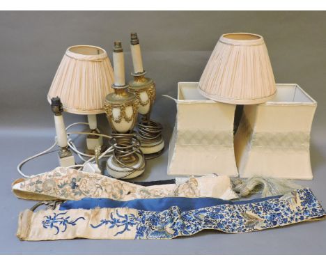 Two pairs of marble and gilt mounted table lamps, with shades, and two embroidered light pulls