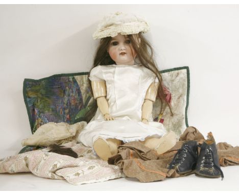 A German bisque head doll, by GE Bruder, inscribed '30.7 Gbr 160 K', open mouth and brown eyes, 63cm high
