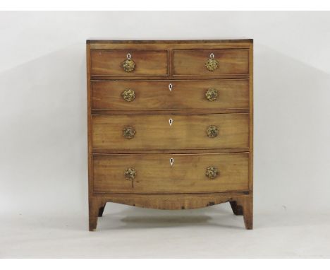 A Regency mahogany bow front chest, with cast gilt handles, chequer strung top board, and ivory escutcheons, 81cm wide, 48cm 