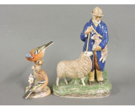 A pottery figure of a shepherd, by George Soper, inscribed below and dated 1930, and a Royal Worcester group of two chaffinch