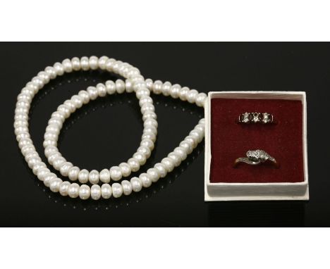 A simulated pearl necklace, and two rings