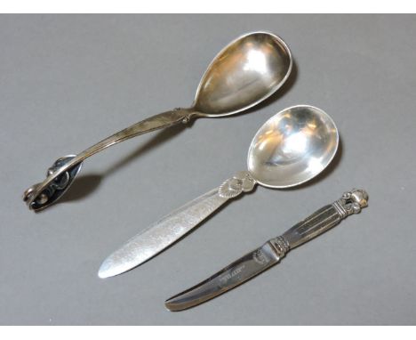 A Danish sterling silver ladle, by W&S Sorensen, 16cm long, a Georg Jensen sterling silver Cactus pattern spoon, 14cm long, a