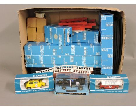 A 1970s Scalextric set, with two Minis, a JPS racing car, and accessories