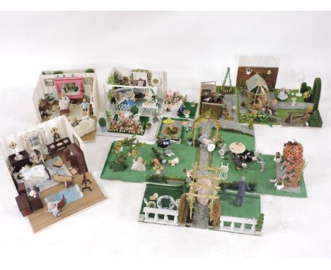 A collection of five dolls' dioramas, by Joan Beard, each box opening to reveal room settings, The Puppet Show, Garden Room, 