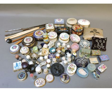 A collection of porcelain and enamel trinket boxes, together with a small quantity of bijouterie