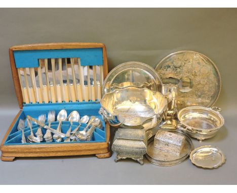A silver vase, marks erased, a pewter tea caddy, assorted silver-plated ware, and a canteen of cutlery