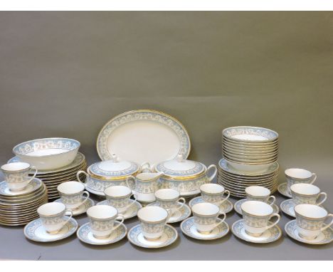 A Noritake part dinner and tea service, 'Polonaise' pattern, white ground with a blue and gilt scrolling floral design