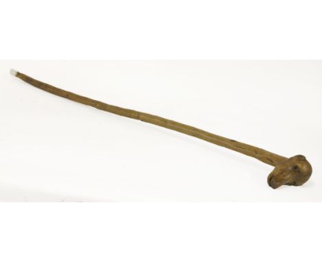 A Zulu hardwood stick, with carved baboon's head finial, and three further sticks