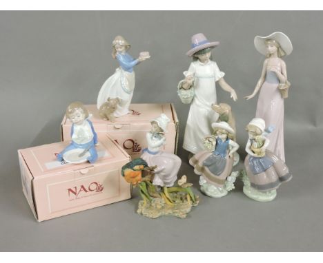 A large quantity of Nao porcelain figurines, to include a girl with a dog, an elegant girl, a girl seated with puppy, and oth