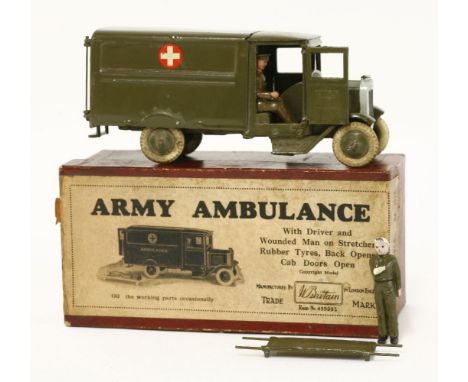 A Britains 'Army Ambulance', No1512, in olive green, with white tyres, driver and casualty on stretcher, in original box, par